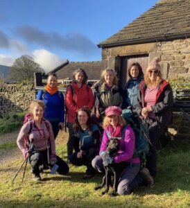 8 women from Lobular Breast Cancer UK wearing walking gear for their Walking our Mammaries fundraising challenge. They have all had a Lobular Breast Cancer diagnosis.