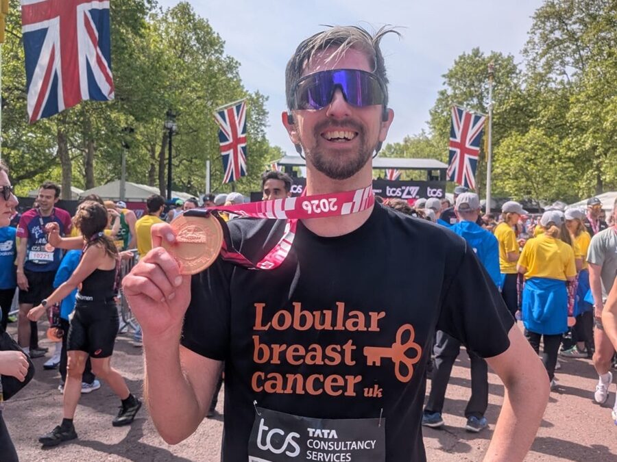 Ben completes the London Marathon and proudly shows off his medal