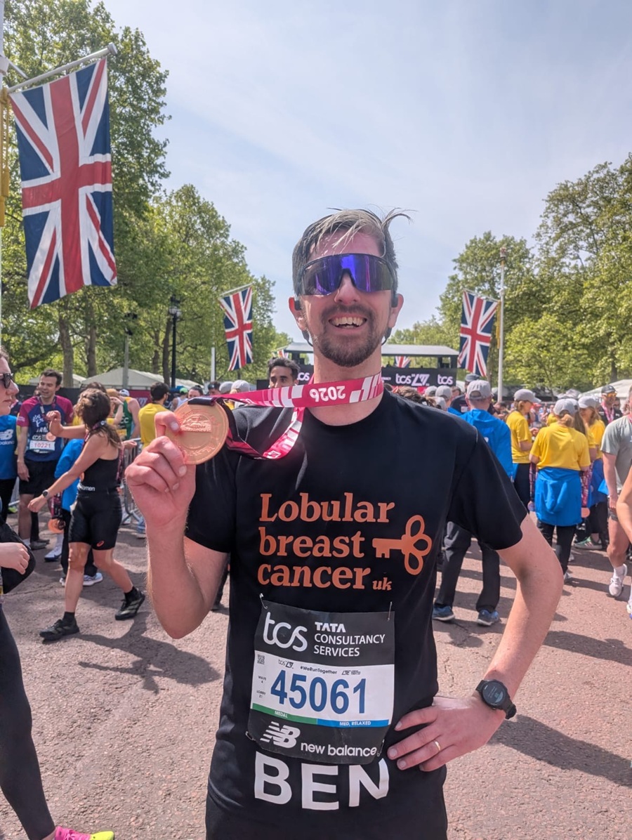 Ben completes the London Marathon and proudly shows off his medal